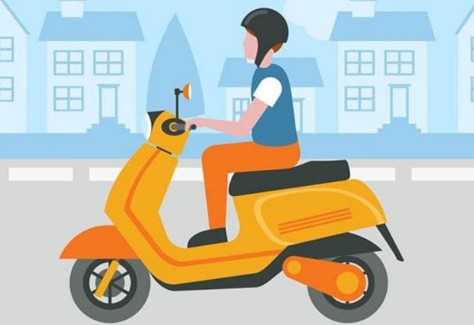 Người đang lái xe máy trên đường phố, biểu tượng cho sự tự do và di chuyển trong giấc mơ