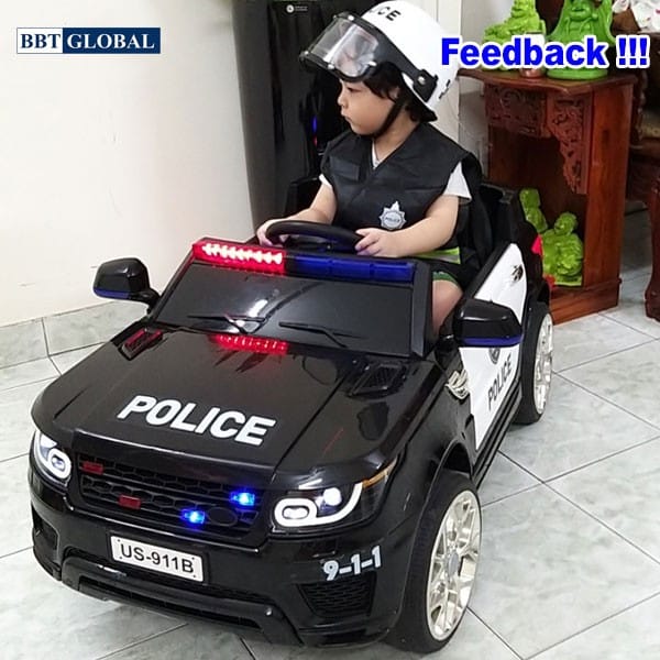 Xe ô tô trẻ em cảnh sát kiểu Mỹ màu trắng xanh với đèn và còi hú